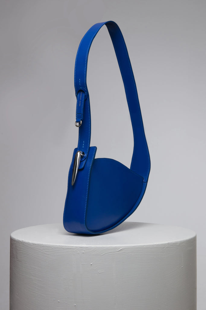 Blue oval shape leather handbag with metal accessories