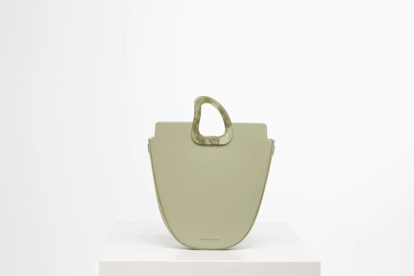 Midi flat topped oval structured green calf leather tote bag with natural resin round handles and a removable adjustable calf leather strap