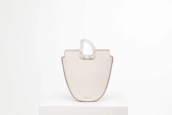 Midi flat topped oval structured off white calf leather tote bag with natural resin round handles and a removable adjustable calf leather strap